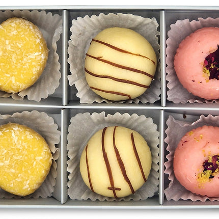Treat yourself with Exclusively Luxe assorted mithai truffles in rose, coconut and chocolate swirl.
