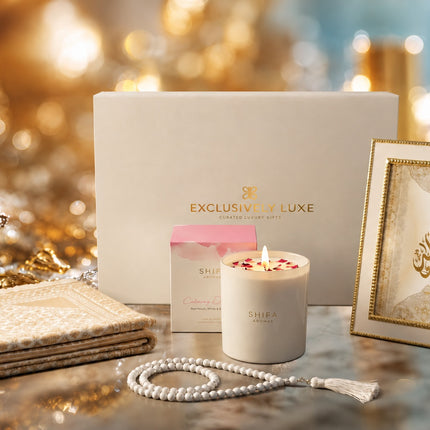Luxury Sakinah Islamic Hamper in ivory and gold featuring prayer mat, pearl-white tasbih beads, framed Islamic calligraphy and Shifa Aromas fragrance.
