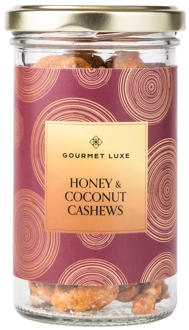 Exclusively Luxe Honey and Coconut Cashews in glass jar with gold lid and decorative label