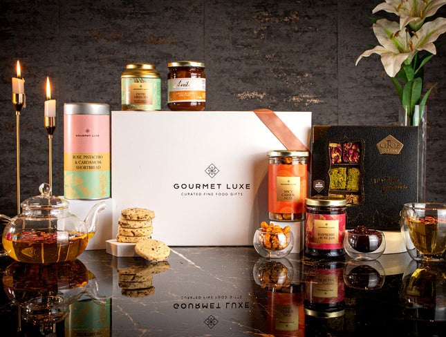 Exclusively Luxe curated fine gifts with candles, treats, and white lily