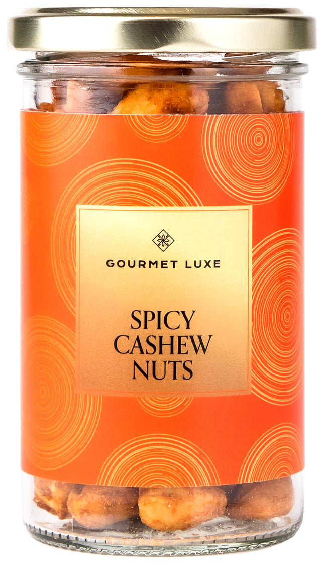 Exclusively Luxe spicy cashew nuts in glass jar with gold lid and orange label